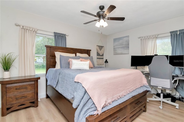 125 Siobhan Ave, Tampa, FL 33613 - bedroom with light wood-style flooring and ceiling fan