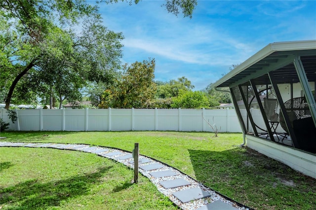 125 Siobhan Ave, Tampa, FL 33613 - view of yard featuring a sunroom and fence