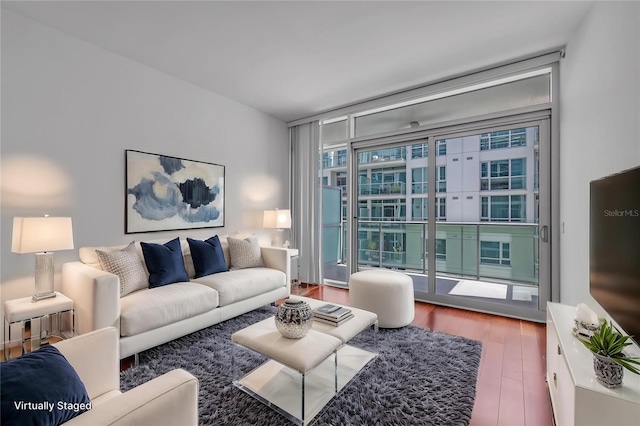 111 N 12th St Unit 1614, Tampa, FL 33602 - living area featuring expansive windows and wood finished floors