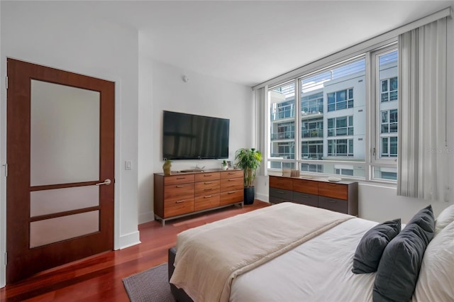 111 N 12th St Unit 1614, Tampa, FL 33602 - bedroom with wood finished floors and baseboards