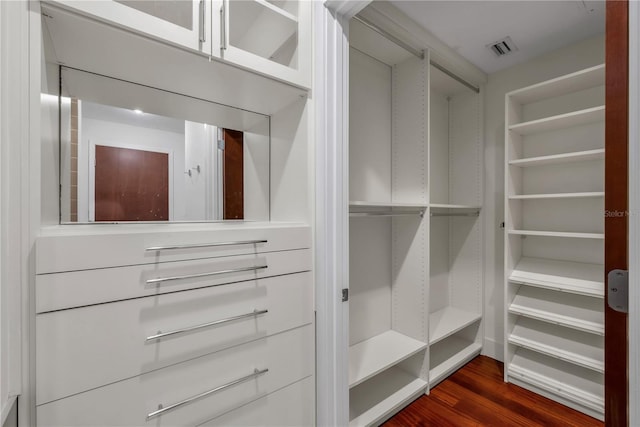 111 N 12th St Unit 1614, Tampa, FL 33602 - spacious closet featuring dark wood finished floors
