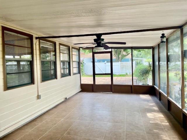 5905 Caroline Dr, Wesley Chapel, FL 33545 - unfurnished sunroom with a ceiling fan