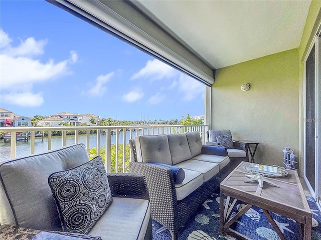 balcony featuring an outdoor hangout area and a water view