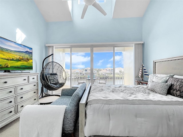 bedroom featuring access to outside, high vaulted ceiling, and carpet