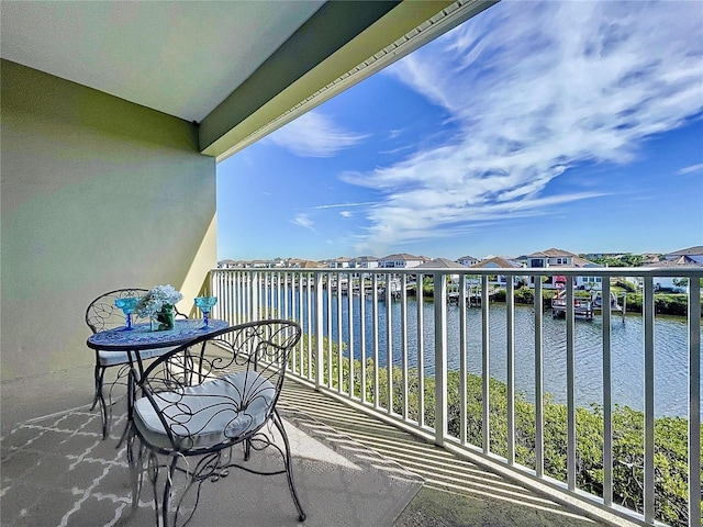 balcony with a water view and a residential view