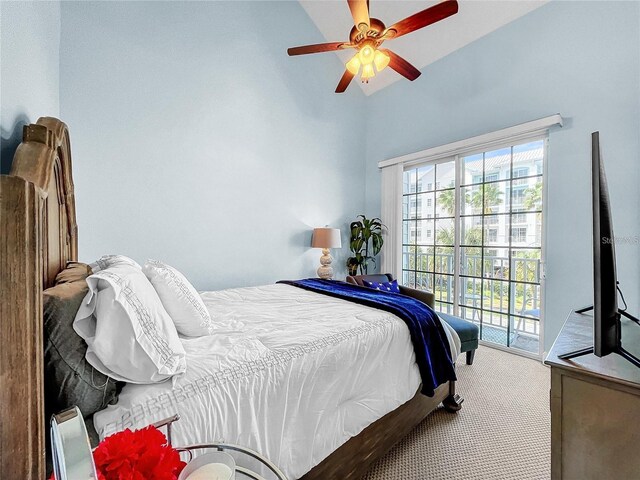 bedroom with carpet, access to outside, ceiling fan, and high vaulted ceiling