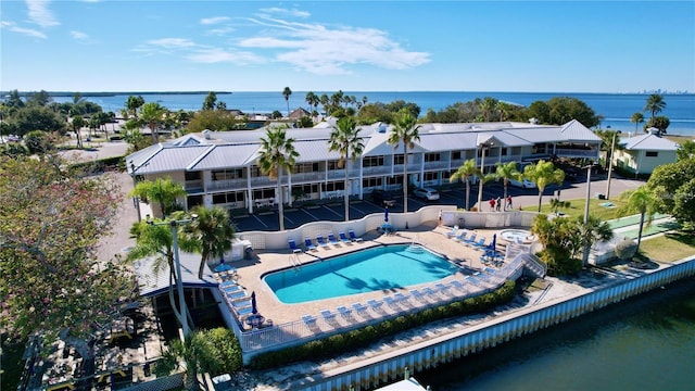 bird's eye view of a large body of water and a pool area