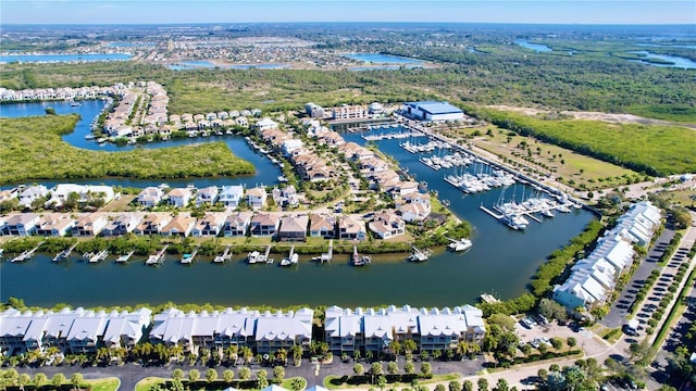 aerial view of residential area with a large body of water and a marina