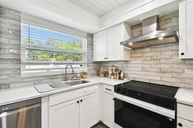 3202 W Coachman Ave, Tampa, FL 33611 - kitchen featuring black electric range oven, wall chimney exhaust hood, dishwasher, a sink, and decorative backsplash
