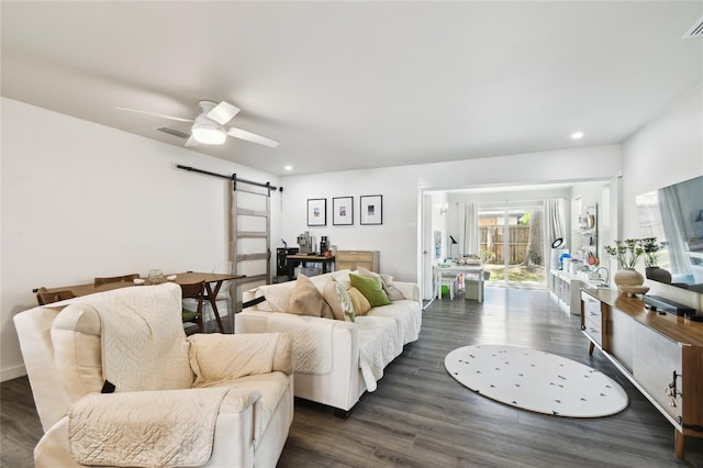 3202 W Coachman Ave, Tampa, FL 33611 - living area featuring a barn door, dark wood-style floors, recessed lighting, and a ceiling fan
