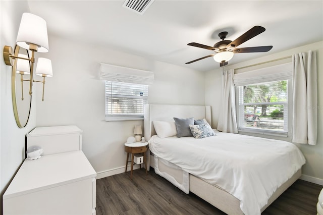 3202 W Coachman Ave, Tampa, FL 33611 - bedroom with baseboards, dark wood-style flooring, and ceiling fan