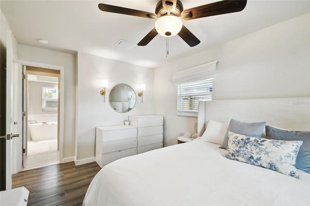 3202 W Coachman Ave, Tampa, FL 33611 - bedroom featuring dark wood-style floors, multiple windows, baseboards, and ceiling fan