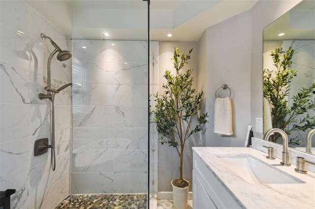 3202 W Coachman Ave, Tampa, FL 33611 - bathroom featuring vanity, a marble finish shower, and recessed lighting