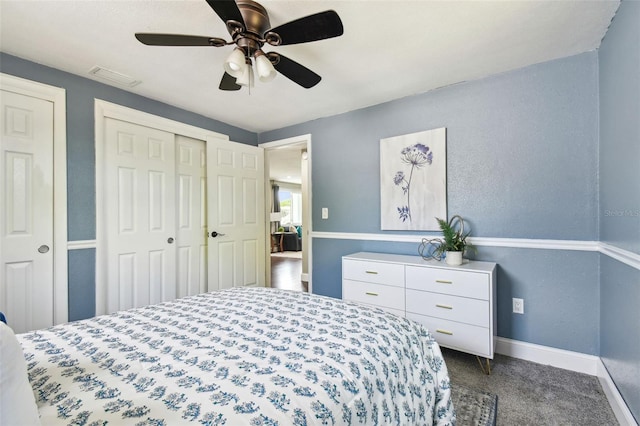 bedroom featuring carpet, baseboards, visible vents, a ceiling fan, and a closet