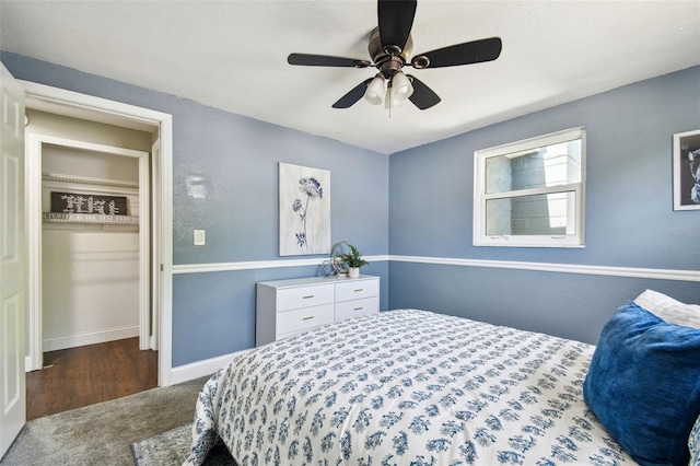 bedroom featuring baseboards, carpet flooring, and ceiling fan
