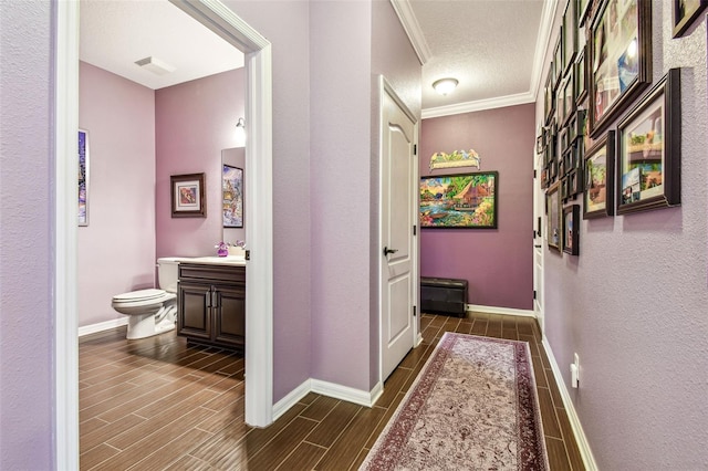 21627 Pearl Crescent Ct, Land O Lakes, FL 34637 - hallway with crown molding, visible vents, baseboards, and wood finish floors