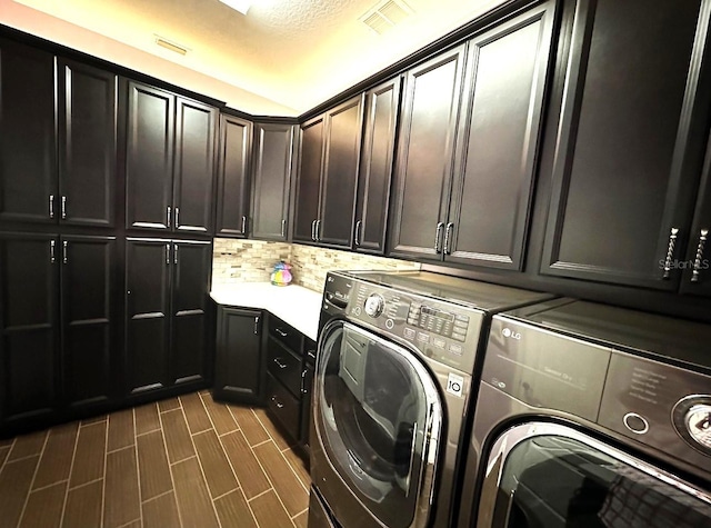 21627 Pearl Crescent Ct, Land O Lakes, FL 34637 - laundry room with visible vents, washing machine and clothes dryer, and cabinet space