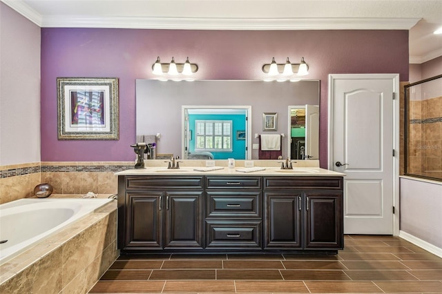 21627 Pearl Crescent Ct, Land O Lakes, FL 34637 - bathroom featuring a bath, a sink, ornamental molding, double vanity, and wood finish floors