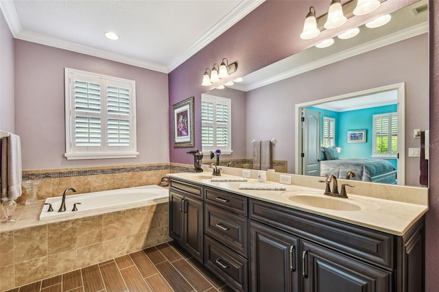 21627 Pearl Crescent Ct, Land O Lakes, FL 34637 - bathroom featuring a sink, a garden tub, ensuite bath, and a healthy amount of sunlight