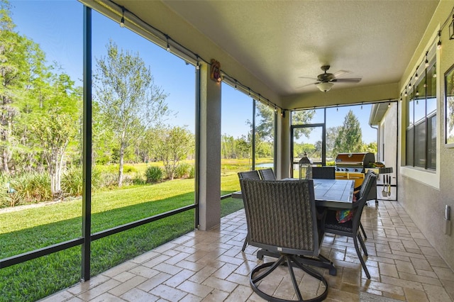 21627 Pearl Crescent Ct, Land O Lakes, FL 34637 - sunroom with ceiling fan and outdoor dining area
