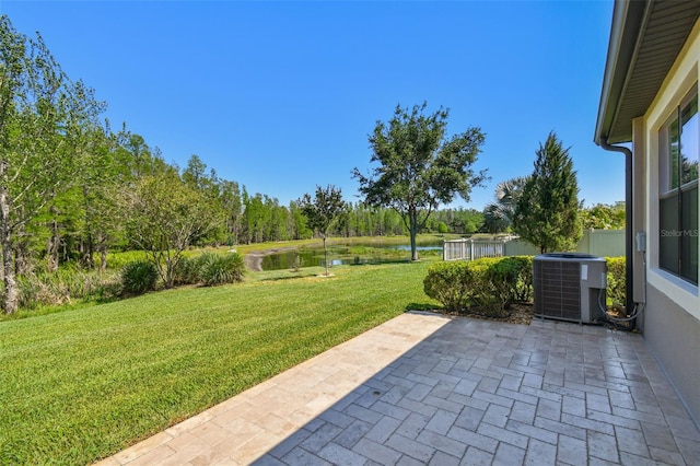 21627 Pearl Crescent Ct, Land O Lakes, FL 34637 - view of yard with central AC unit, a patio, and a water view