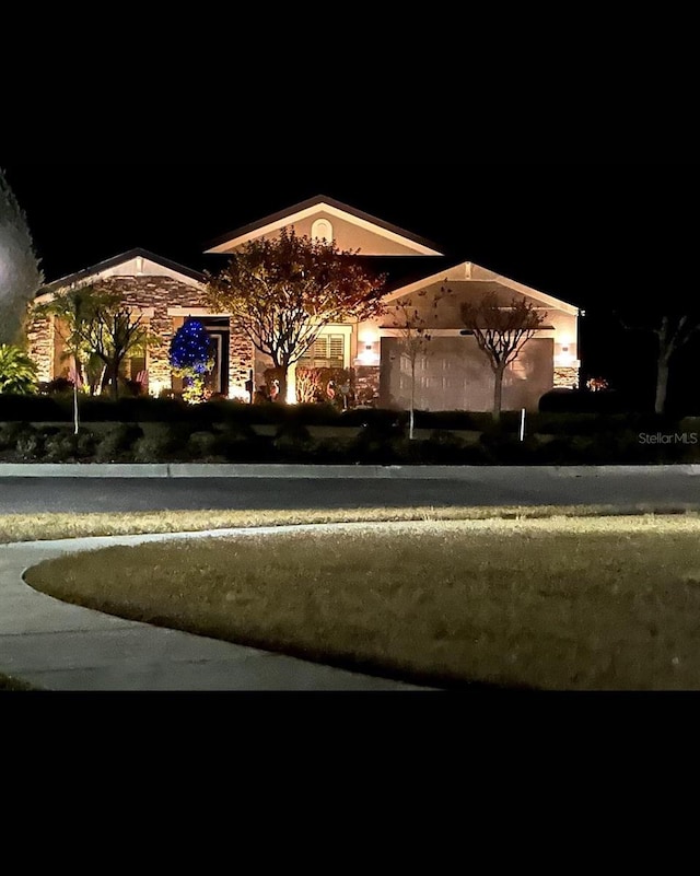 21627 Pearl Crescent Ct, Land O Lakes, FL 34637 - exterior space with stone siding
