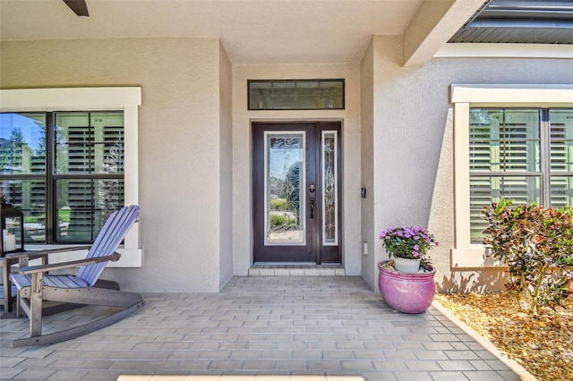 21627 Pearl Crescent Ct, Land O Lakes, FL 34637 - doorway to property featuring stucco siding