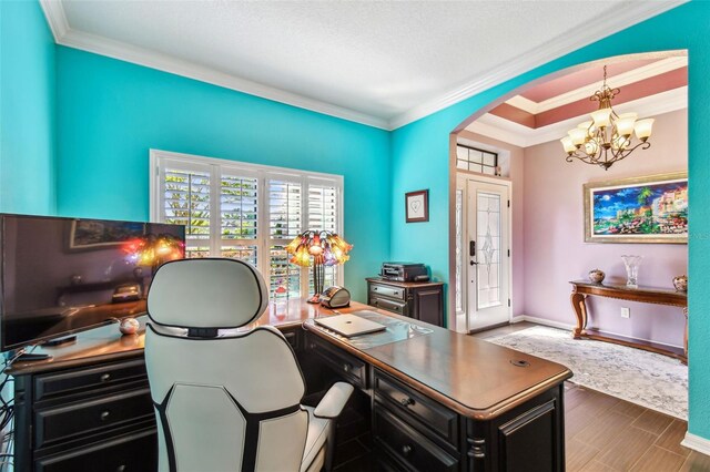 21627 Pearl Crescent Ct, Land O Lakes, FL 34637 - office space featuring baseboards, an inviting chandelier, crown molding, arched walkways, and wood finished floors
