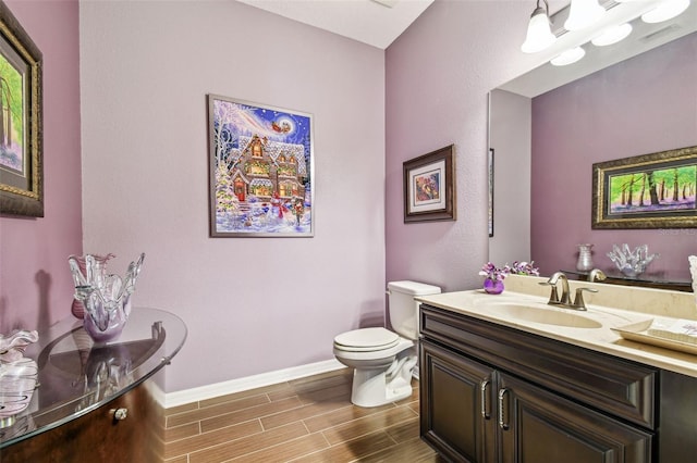 21627 Pearl Crescent Ct, Land O Lakes, FL 34637 - half bathroom with toilet, wood finish floors, baseboards, and vanity