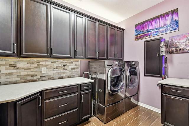 21627 Pearl Crescent Ct, Land O Lakes, FL 34637 - washroom with cabinet space, washing machine and clothes dryer, baseboards, and wood finish floors