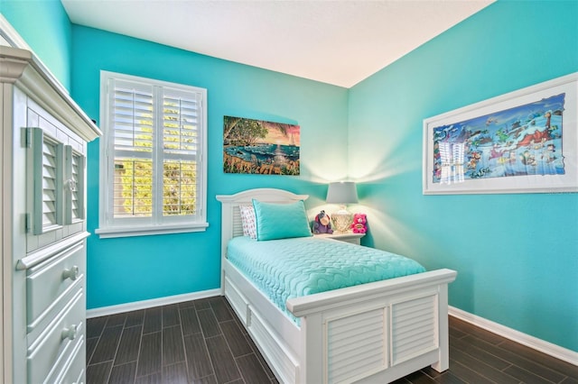 21627 Pearl Crescent Ct, Land O Lakes, FL 34637 - bedroom featuring baseboards and wood finish floors