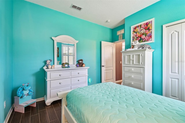 21627 Pearl Crescent Ct, Land O Lakes, FL 34637 - bedroom with a closet, visible vents, baseboards, and wood tiled floor
