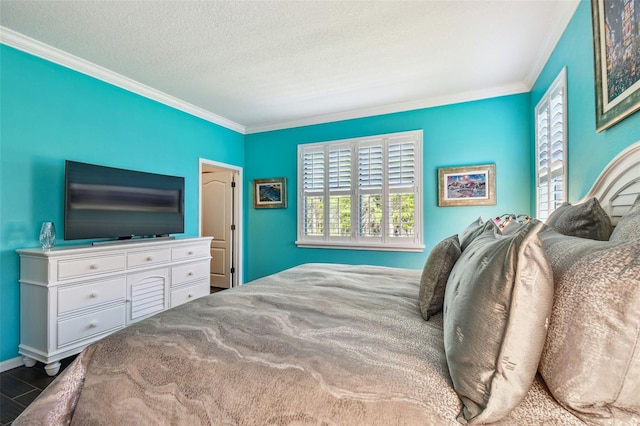 21627 Pearl Crescent Ct, Land O Lakes, FL 34637 - bedroom featuring ornamental molding, baseboards, and a textured ceiling