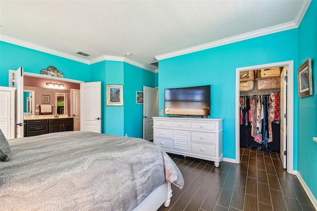 21627 Pearl Crescent Ct, Land O Lakes, FL 34637 - bedroom featuring crown molding, a closet, a spacious closet, and baseboards