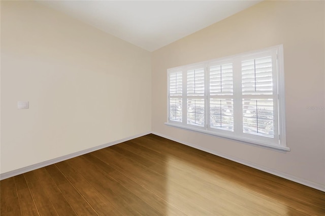 21627 Pearl Crescent Ct, Land O Lakes, FL 34637 - spare room with dark wood-style flooring and baseboards