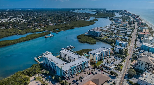 birds eye view of property featuring a city view and a water view