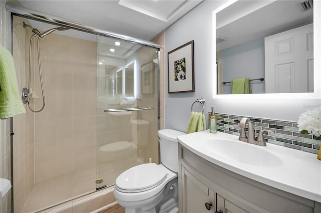 14723 Seminole Trl, Seminole, FL 33776 - bathroom with vanity, decorative backsplash, a stall shower, and toilet
