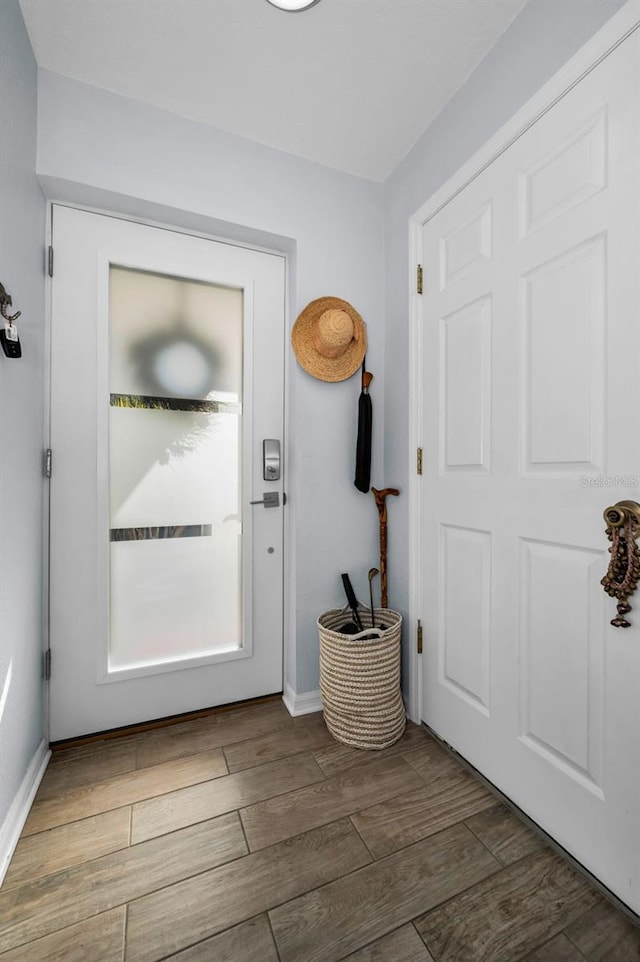 14723 Seminole Trl, Seminole, FL 33776 - entryway with baseboards and wood finished floors