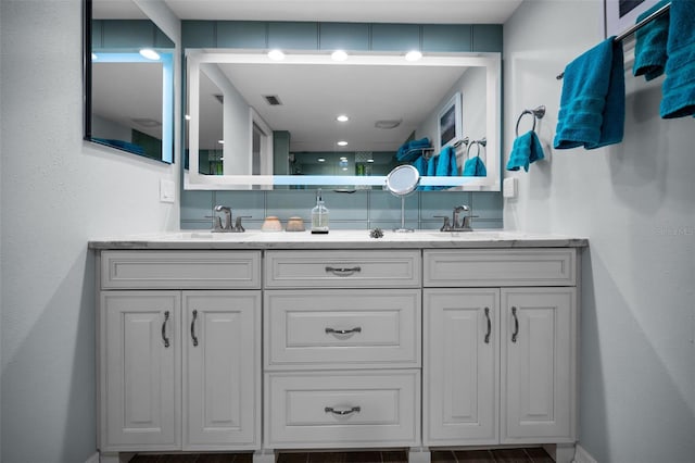 14723 Seminole Trl, Seminole, FL 33776 - bathroom featuring double vanity, a sink, and visible vents