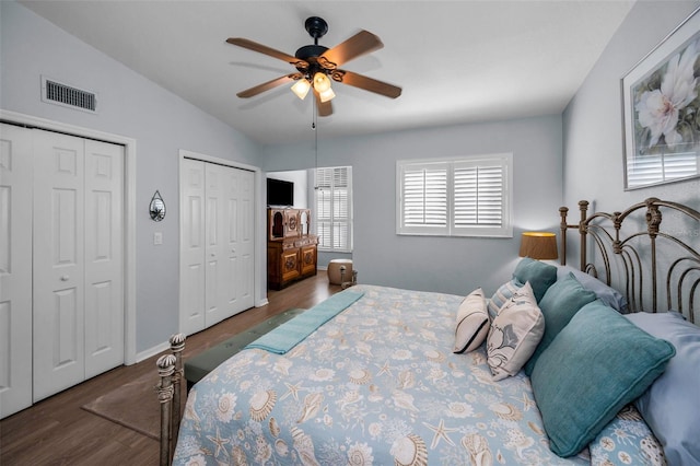 14723 Seminole Trl, Seminole, FL 33776 - bedroom with visible vents, wood finished floors, two closets, ceiling fan, and vaulted ceiling