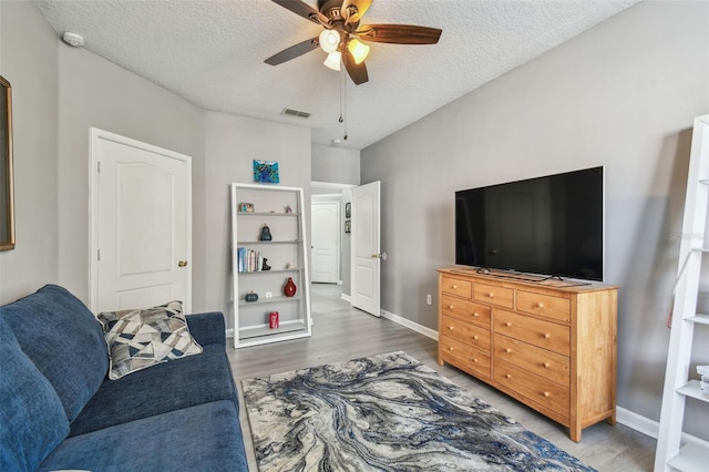 10442 Villa View Cir, Tampa, FL 33647 - living room featuring visible vents, ceiling fan, wood finished floors, and a textured ceiling