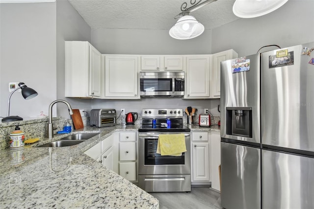 10442 Villa View Cir, Tampa, FL 33647 - kitchen with a sink, white cabinetry, and stainless steel appliances