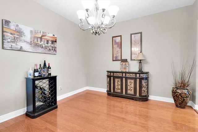 12304 Freesia Ct, Riverview, FL 33569 - interior space featuring a chandelier, baseboards, and wood finished floors