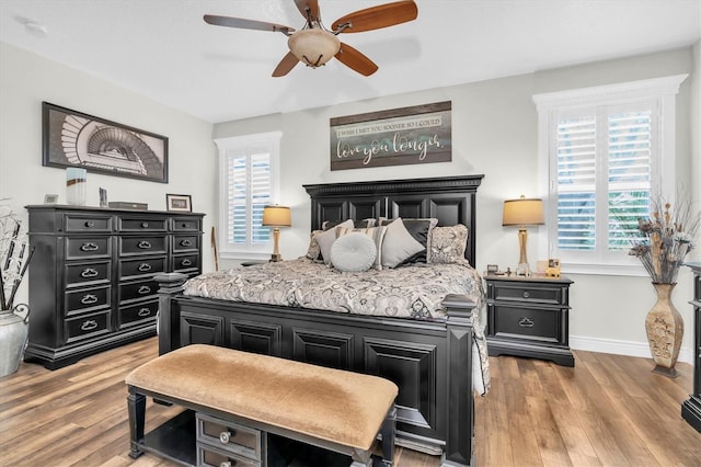12304 Freesia Ct, Riverview, FL 33569 - bedroom featuring light wood-type flooring, ceiling fan, and baseboards