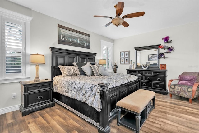 12304 Freesia Ct, Riverview, FL 33569 - bedroom featuring ceiling fan, baseboards, and wood finished floors