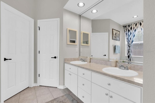 12304 Freesia Ct, Riverview, FL 33569 - full bath with recessed lighting, tile patterned floors, double vanity, and a sink