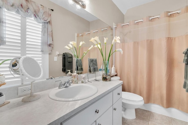 12304 Freesia Ct, Riverview, FL 33569 - full bathroom with toilet, tile patterned floors, vanity, and a wealth of natural light