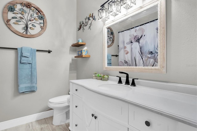 12304 Freesia Ct, Riverview, FL 33569 - bathroom with vanity, a shower with curtain, toilet, wood finished floors, and baseboards