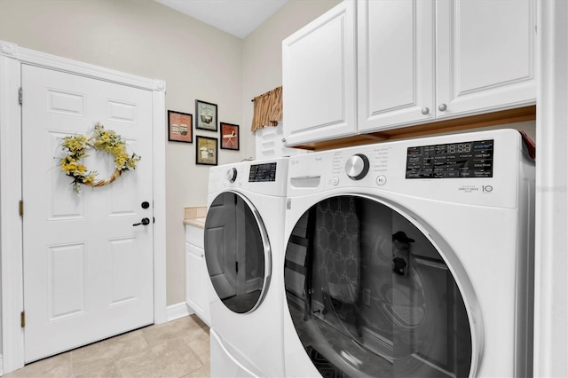 12304 Freesia Ct, Riverview, FL 33569 - laundry area with cabinet space, light tile patterned floors, and washing machine and dryer