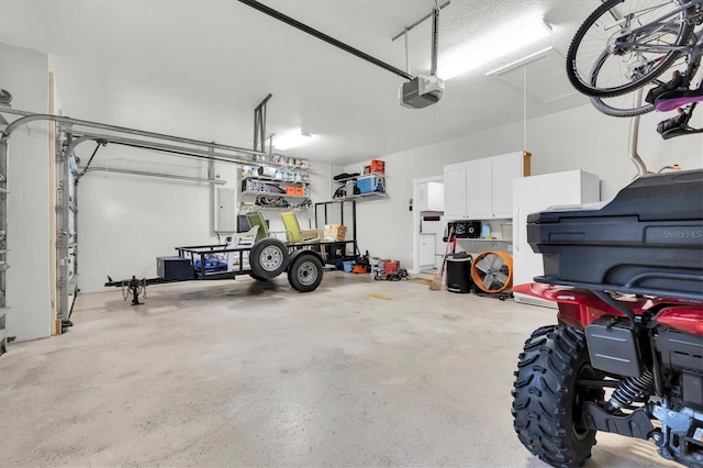 12304 Freesia Ct, Riverview, FL 33569 - garage featuring a garage door opener